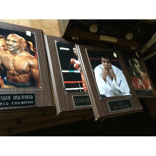 153 - Four framed boxing photographs Thomas Hearns, Ali, Lennox Lewis and Evander Holyfield. (4)