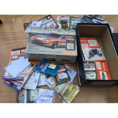260 - Model railway trackside accessories all carded and unused also a Matchbox Sentron 1 , Porsche 928 GT