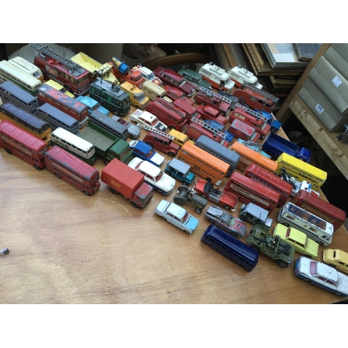267 - A box containing a collection of playworn diecast vehicles including Dinky