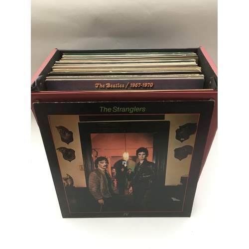 104 - A record box of LPs by various artists including The Beatles, Beach Boys, The Faces and others.