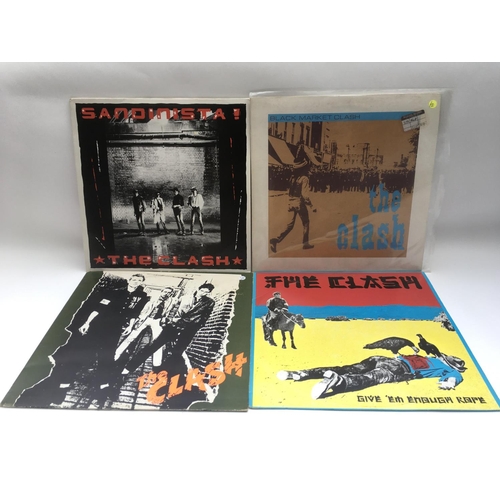 115 - Four LPs by The Clash comprising the self titled debut, 'Sandinista!', 'Black Market Clash' and 'Giv... 