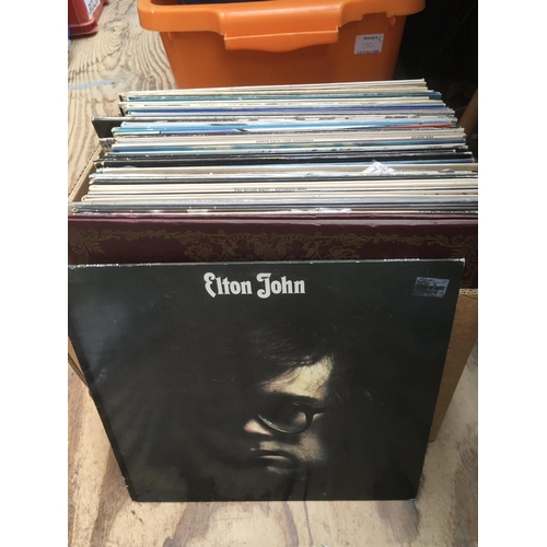 118 - A box of LPs by various artists including Jethro Tull, David Bowie, John Lennon and others.