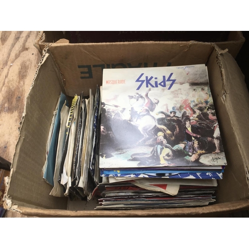 120 - A box of 7 inch singles by various artists from the 1960s onwards..