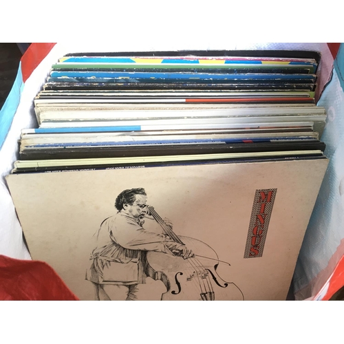 131 - A collection of jazz LPs by various artists including Dizzy Gillespie, Billie Holiday, Charles Mingu... 