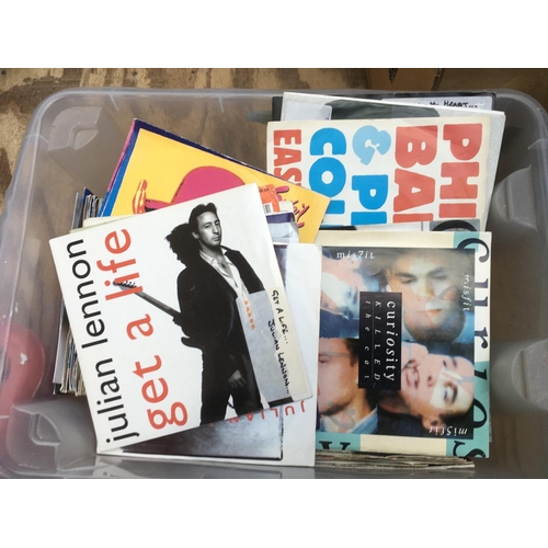 140 - Two boxes of 7 inch singles mainly from the 1980s and 90s plus a small collection of Beatles books.