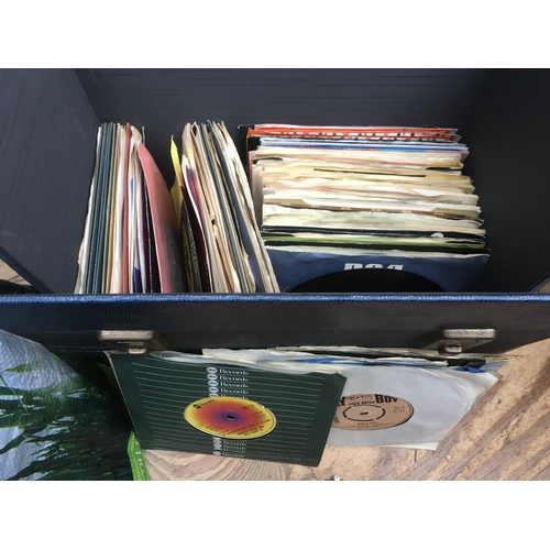 160 - A record box containing a collection of 7 inch singles from the 1960s onwards.