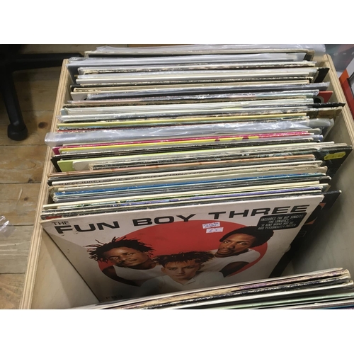 194 - Two boxes of LPs and 12 inch singles by various artists Including Marc Bolan, Nick Lowe and others.
