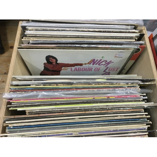194 - Two boxes of LPs and 12 inch singles by various artists Including Marc Bolan, Nick Lowe and others.
