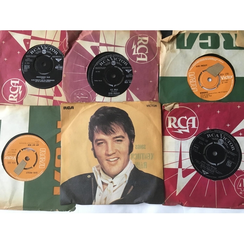 202 - A record box containing Elvis Presley 7inch singles and EPs and seven Elvis monthly magazines.