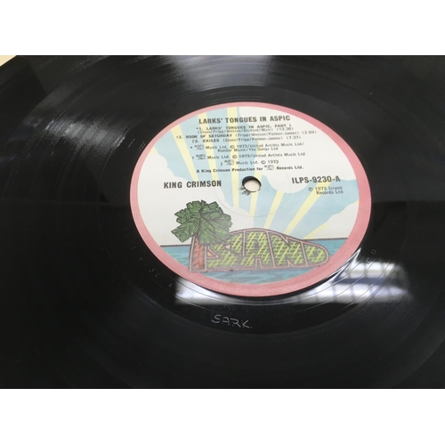 209 - Two King Crimson LPs comprising 'Islands' and 'Larks Tongues In Aspic'. Condition of vinyl is genera... 