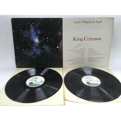 209 - Two King Crimson LPs comprising 'Islands' and 'Larks Tongues In Aspic'. Condition of vinyl is genera... 
