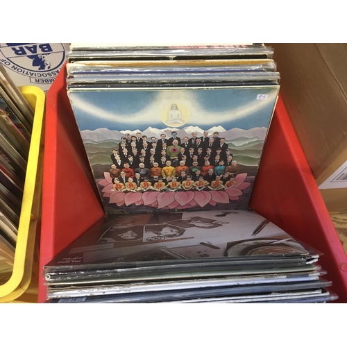 214 - A box of LPs and 12 inch singles by various artists including George Harrison, T Rex, Scorpions and ... 