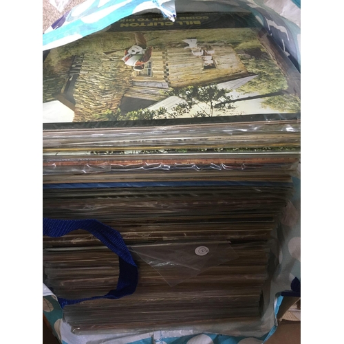 243 - Three bags containing a large collection of country music LPs.