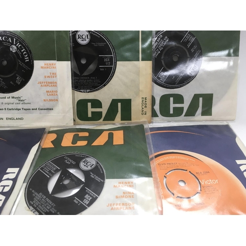 250 - A collection of Elvis Presley 7 inch singles and EPs.
