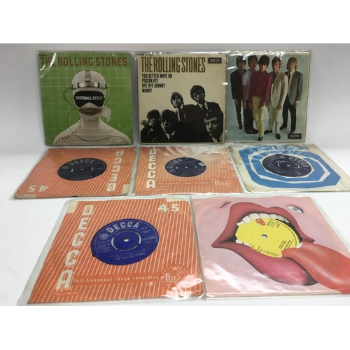 251 - A small collection of Rolling Stones EPs and 7 inch singles.