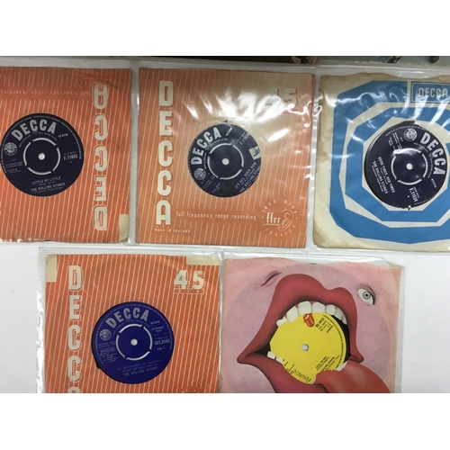251 - A small collection of Rolling Stones EPs and 7 inch singles.