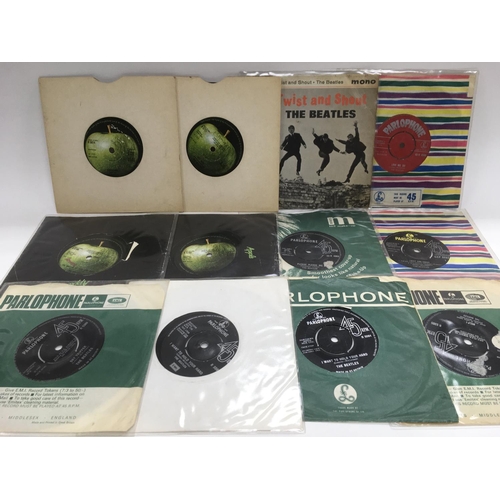 252 - A collection of EPs and 7 inch singles by The Beatles including a red label 'Love Me Do', 'Twist & S... 