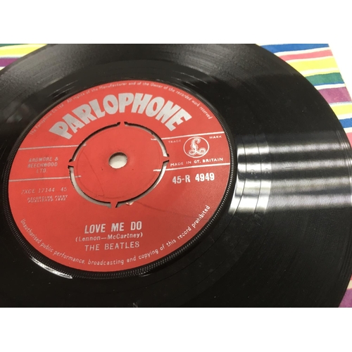 252 - A collection of EPs and 7 inch singles by The Beatles including a red label 'Love Me Do', 'Twist & S... 