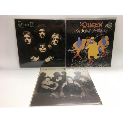 256 - Three Queen LPs comprising 'Queen II', 'The Works' and 'A Kind Of Magic'.