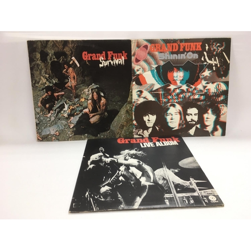 298 - Three Grand Funk Railroad LPs comprising 'Shinin On', 'Survival' and 'Live Album'. Condition general... 