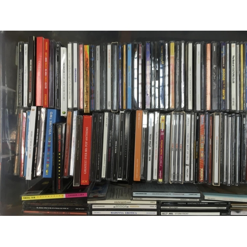 313 - Four boxes of CDs by various artists including Bon Jovi, Madonna, The Beatles and many more.