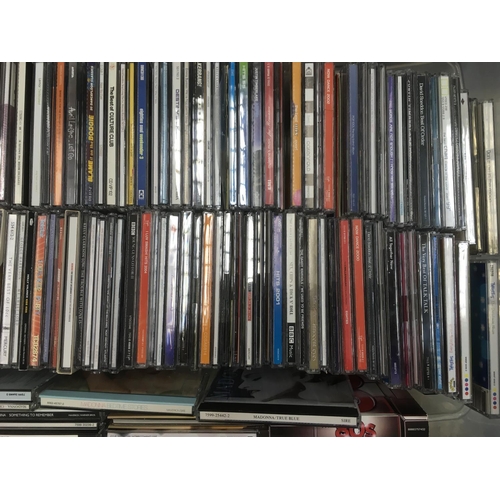 313 - Four boxes of CDs by various artists including Bon Jovi, Madonna, The Beatles and many more.