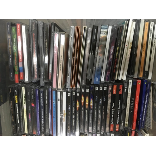 313 - Four boxes of CDs by various artists including Bon Jovi, Madonna, The Beatles and many more.