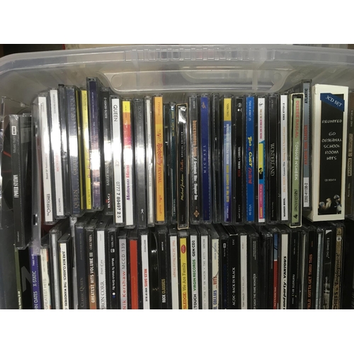 313 - Four boxes of CDs by various artists including Bon Jovi, Madonna, The Beatles and many more.