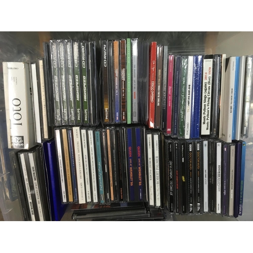 313 - Four boxes of CDs by various artists including Bon Jovi, Madonna, The Beatles and many more.