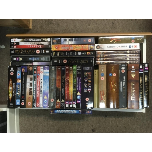 317 - Four drawers of DVDs including box sets.