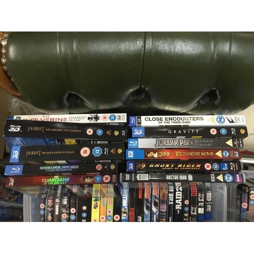 319 - Four boxes of Blu Rays and DVDs including various box sets.