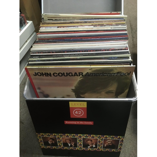 324 - A record case of LPs and 12 inch singles by various artists including Queen, Meat Loaf, Frankie Goes... 