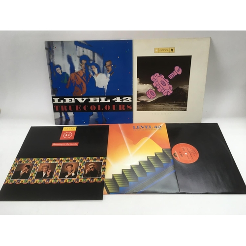 331 - A collection of Level 42 LPs and 12 inch singles.