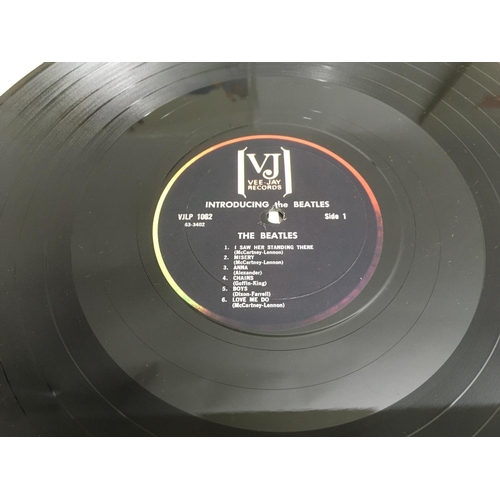 349 - Six US issue LPs by The Beatles comprising 'Introducing...', 'Something New', 'Beatles VI' and other... 