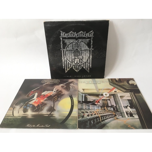 499 - Three Hawkwind LPs comprising 'Doremi Fasol Latido', 'Quark Strangeness And Charm' and 'Hall Of The ... 