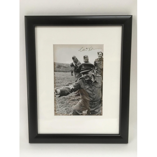 538 - A framed and glazed signed photo of actor Clive Dunn in Dad's Army uniform and depicting fellow acto... 