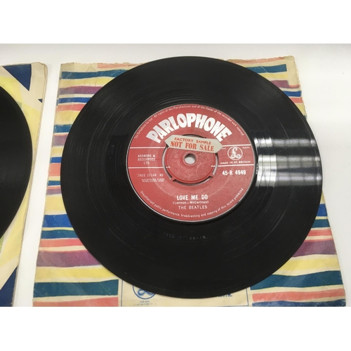 7 - Two early UK issues of The Beatles single 'Love Me Do' b/w 'P.S. I Love You' with red labels and rig... 