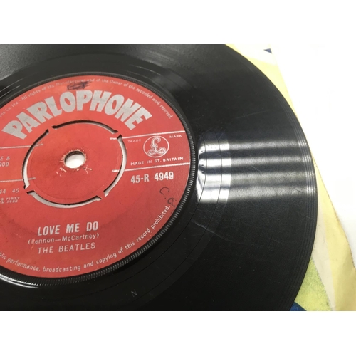7 - Two early UK issues of The Beatles single 'Love Me Do' b/w 'P.S. I Love You' with red labels and rig... 