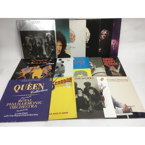 76 - A collection of Queen and related LPs and 12inch singles including 'A Night At The Opera', 'A Day At... 