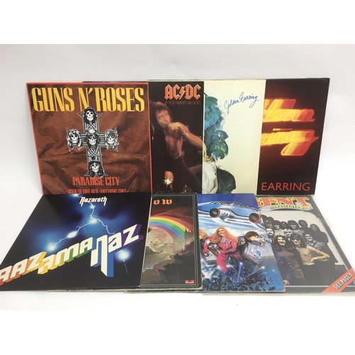 77 - Seven rock LPs by various artists including AC/DC, Nazareth, Gillan and others plus a 12 inch single... 
