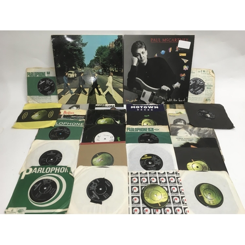 87 - A collection of Beatles and related LPs, EPs and 7 inch singles.