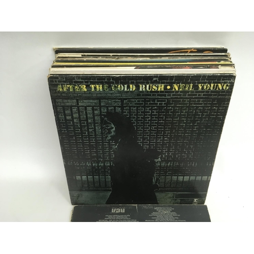 89 - A bag containing LPs by various artists including Neil Young, Lou Reed, Nina Simone and others.