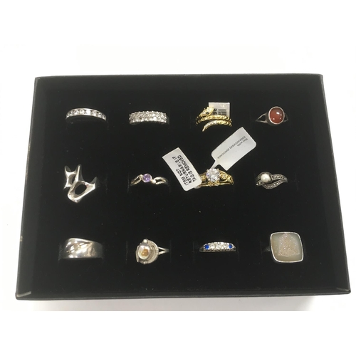 103 - A collection of 12 silver rings, some new.