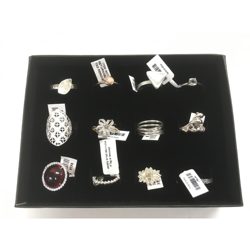 106 - A collection of 12 new silver rings.