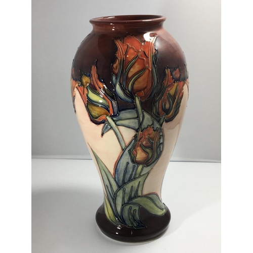 1229 - A large Moorcroft vase decorated with tulips 31cm high no damage. Marks to the base sold with box