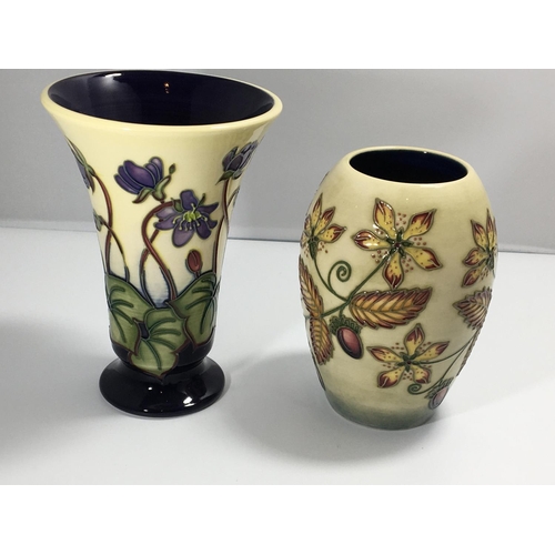 1231 - Two Moorcroft vases Hepatica pattern Hight 16cm and one other vase no damage marks to the base sold ... 