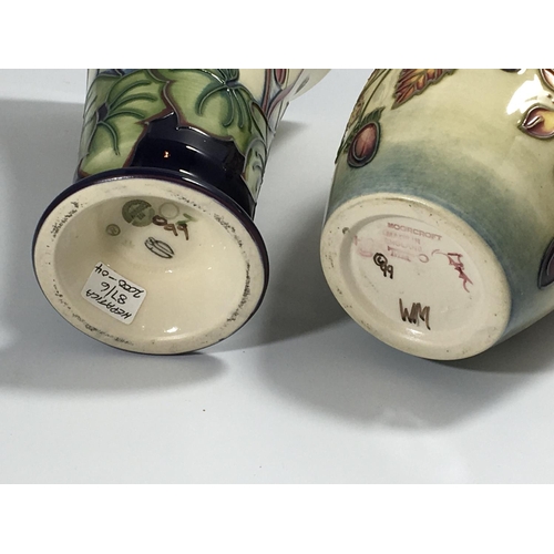 1231 - Two Moorcroft vases Hepatica pattern Hight 16cm and one other vase no damage marks to the base sold ... 