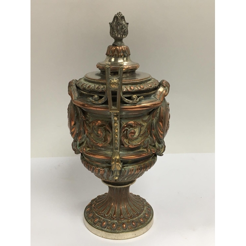 1037 - An impressive classical form silver plate and copper on bronze lidded urn. 24cm.