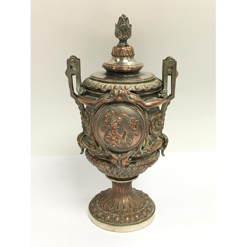 1037 - An impressive classical form silver plate and copper on bronze lidded urn. 24cm.