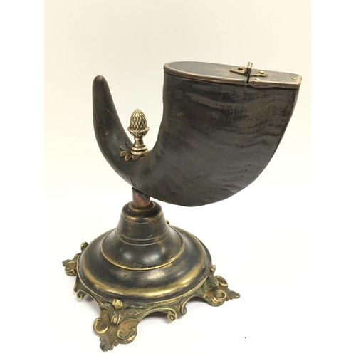 1038 - A Victorian bronze mounted rams horn table snuff. 20.5cm.